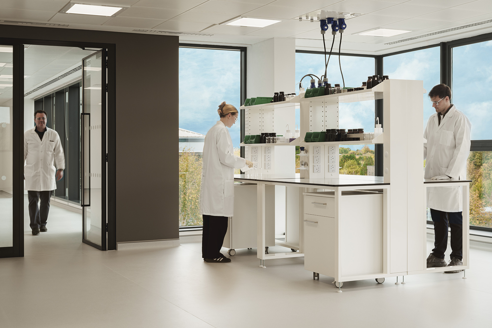 A group of people in white coats.