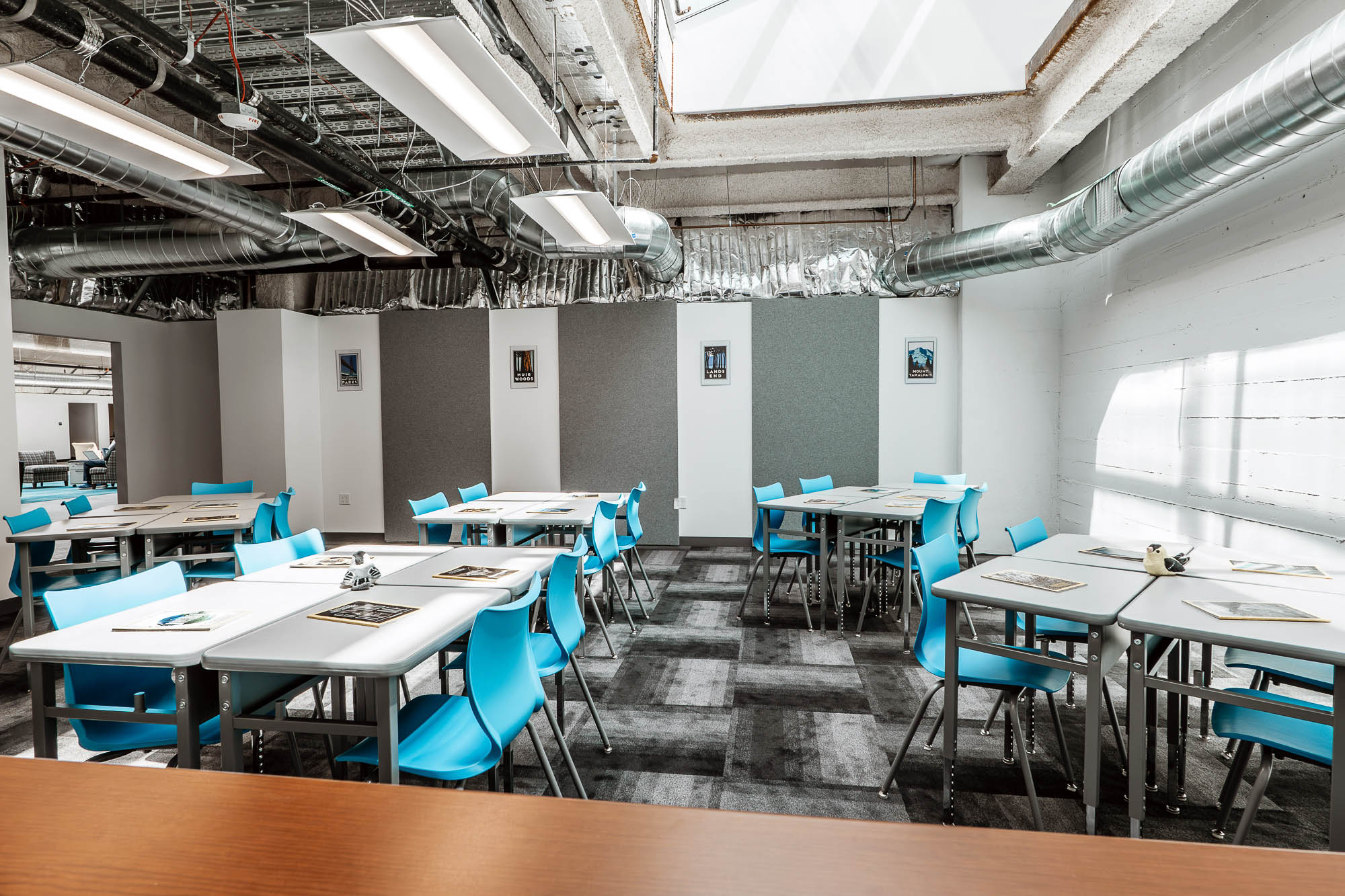 A room with tables and chairs.