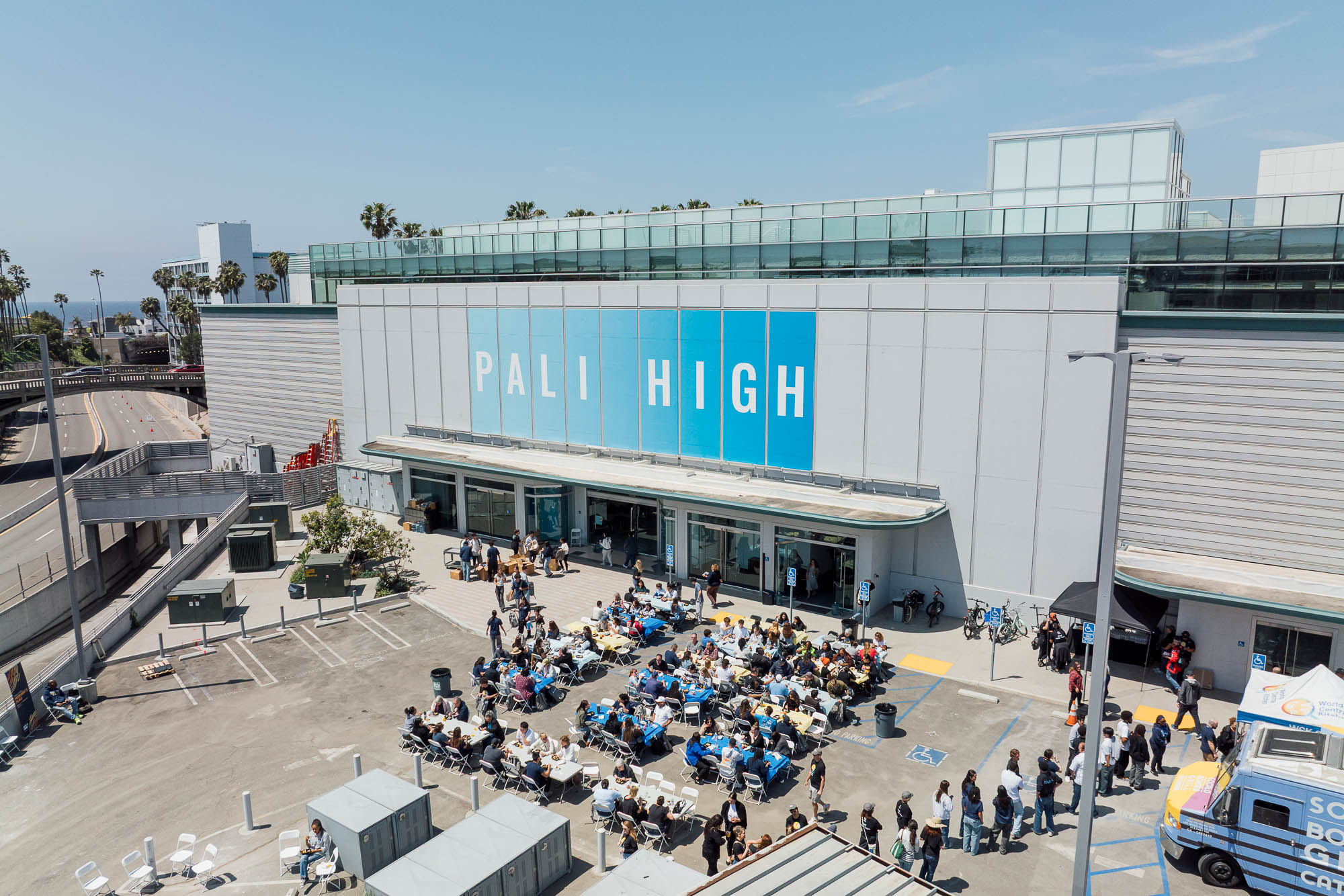 A group of people outside a building.
