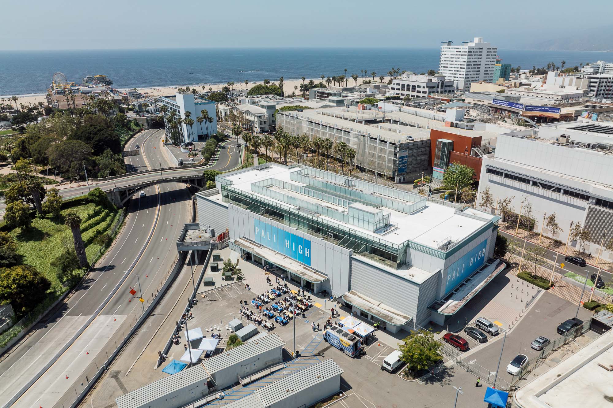 A large building with a parking lot.