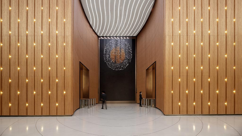 A person standing in a large room.