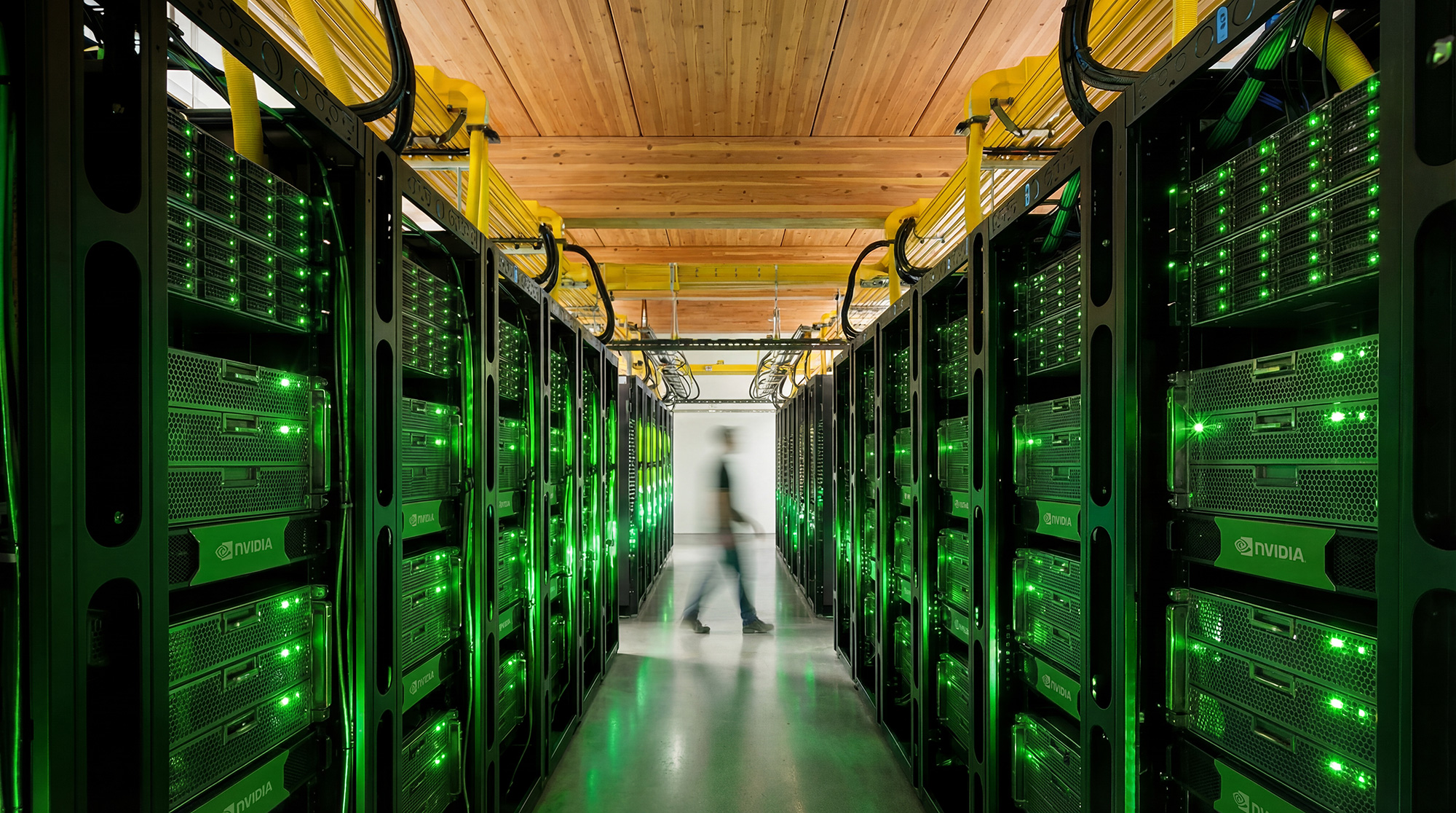 A person walking in a server room.