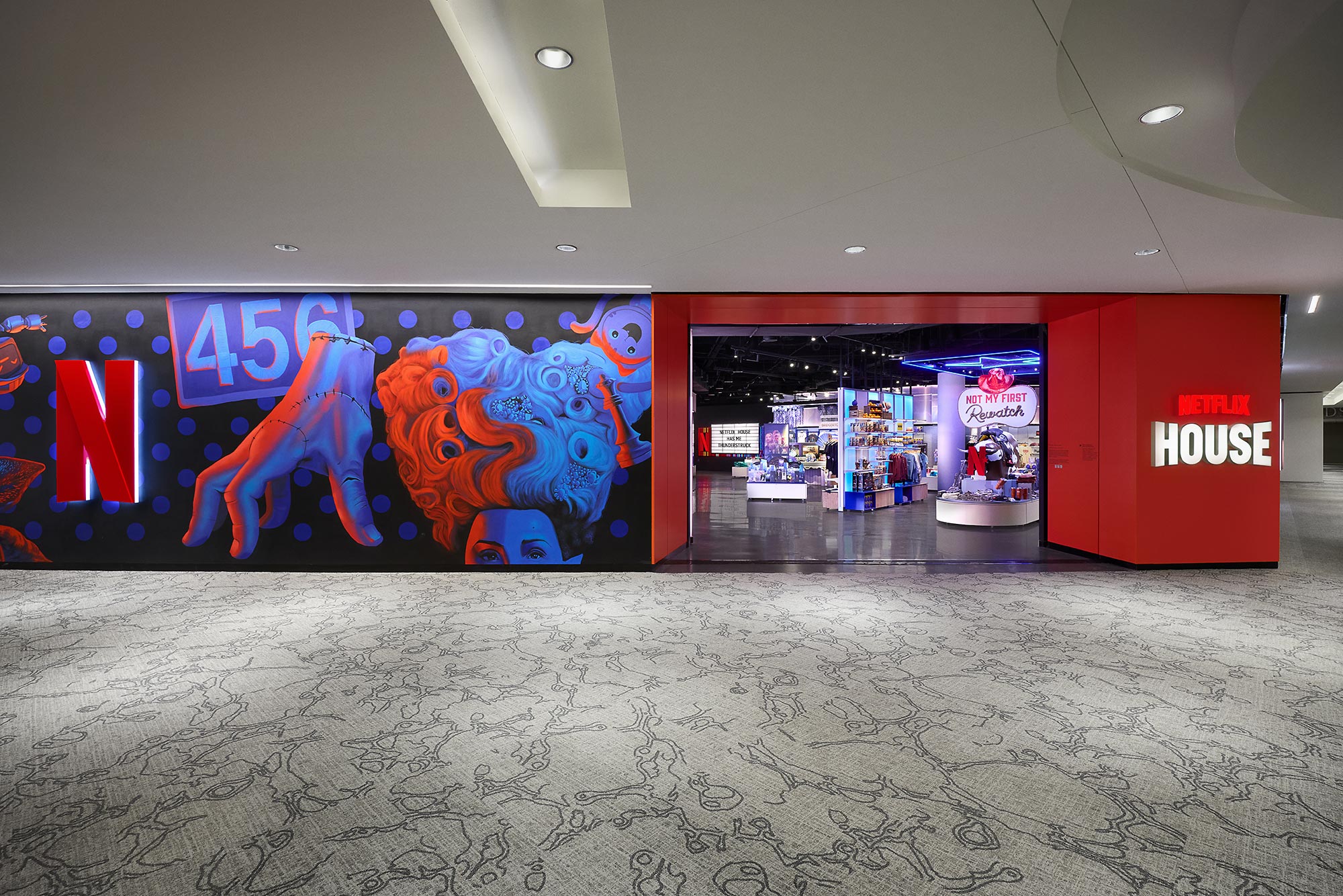 A store with a large mural.