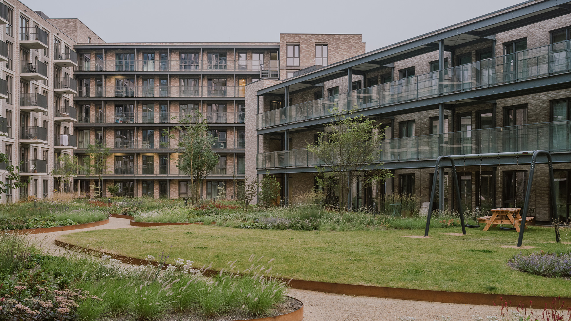 A building with a green lawn.