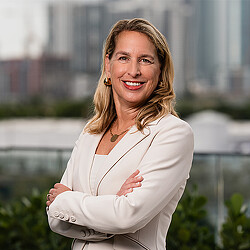 A woman with her arms crossed.