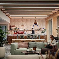 A group of people sitting at a table in a restaurant.