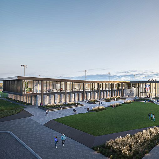 A large stadium with people walking around.