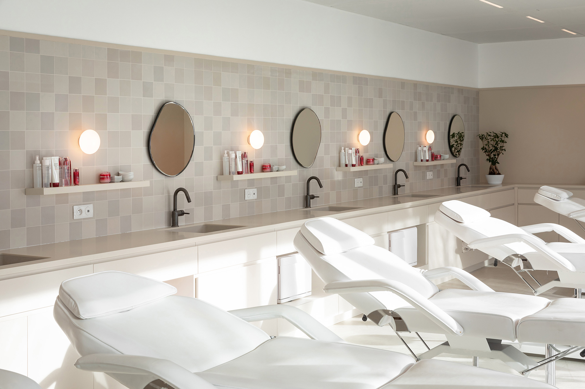 A bathroom with a large mirror.