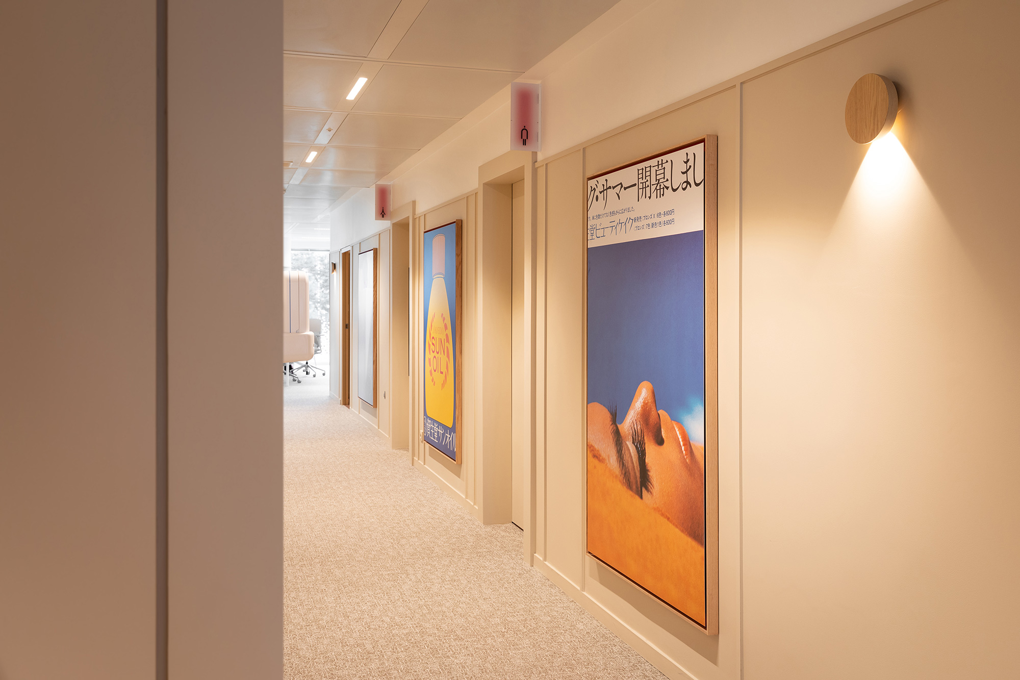 A hallway with posters on the wall.