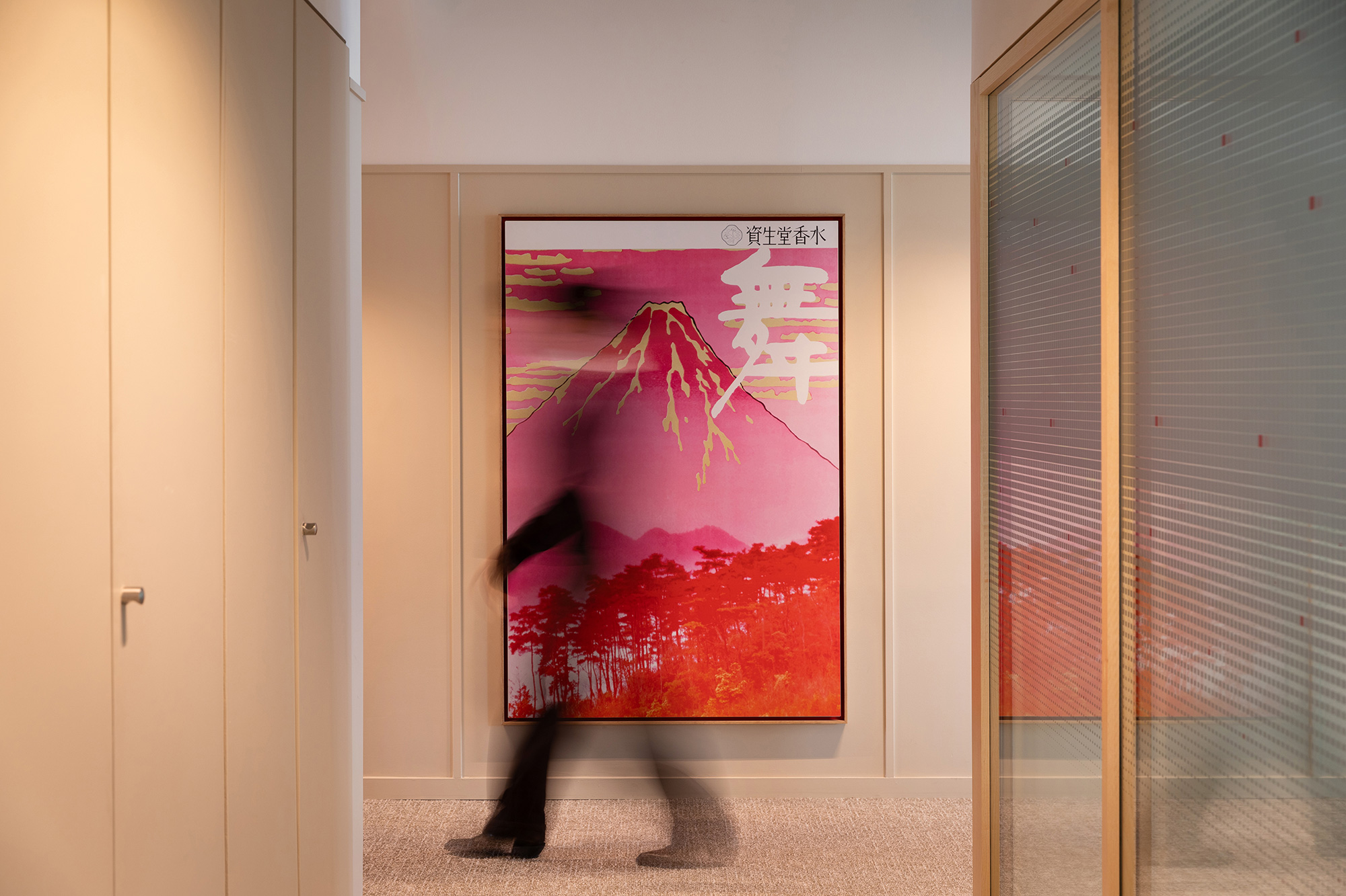 A person standing in a hallway.