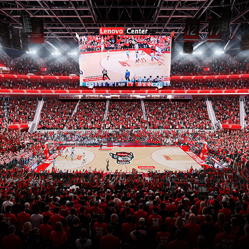A basketball court with a crowd watching.
