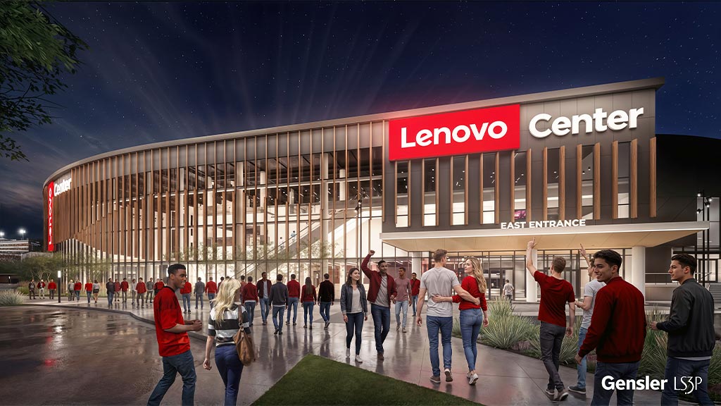 A group of people walking outside of a building.