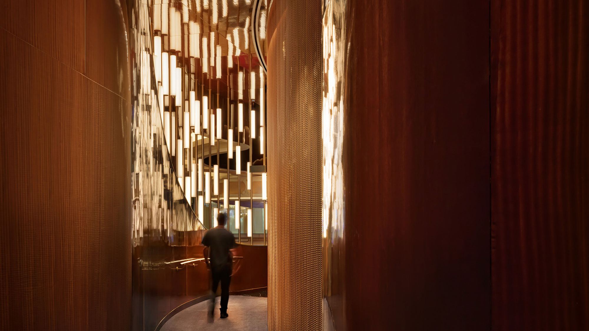 A person walking down a hallway.