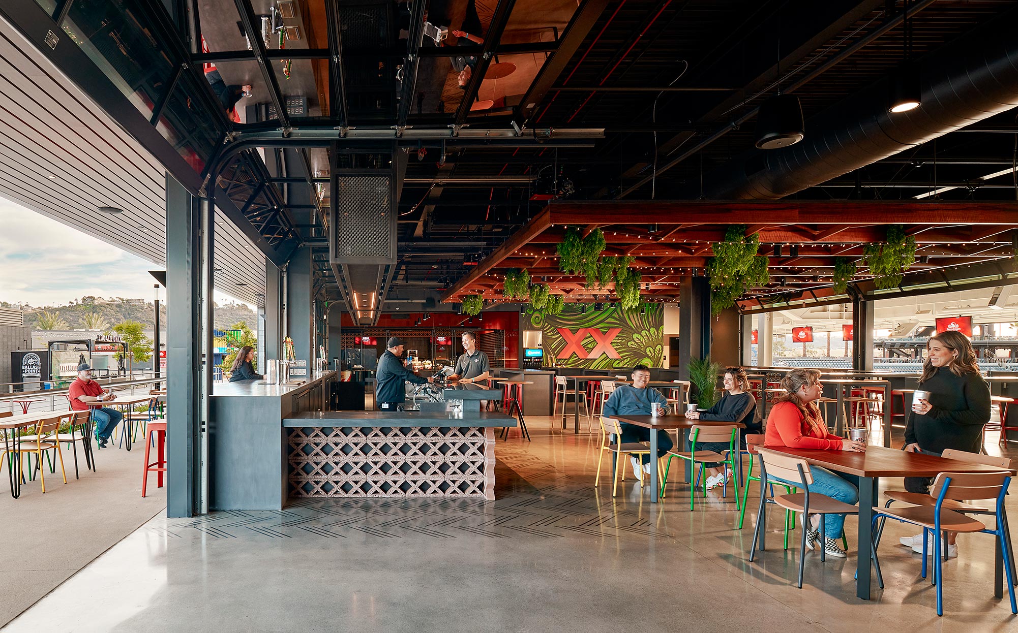 People sitting at tables in a restaurant.