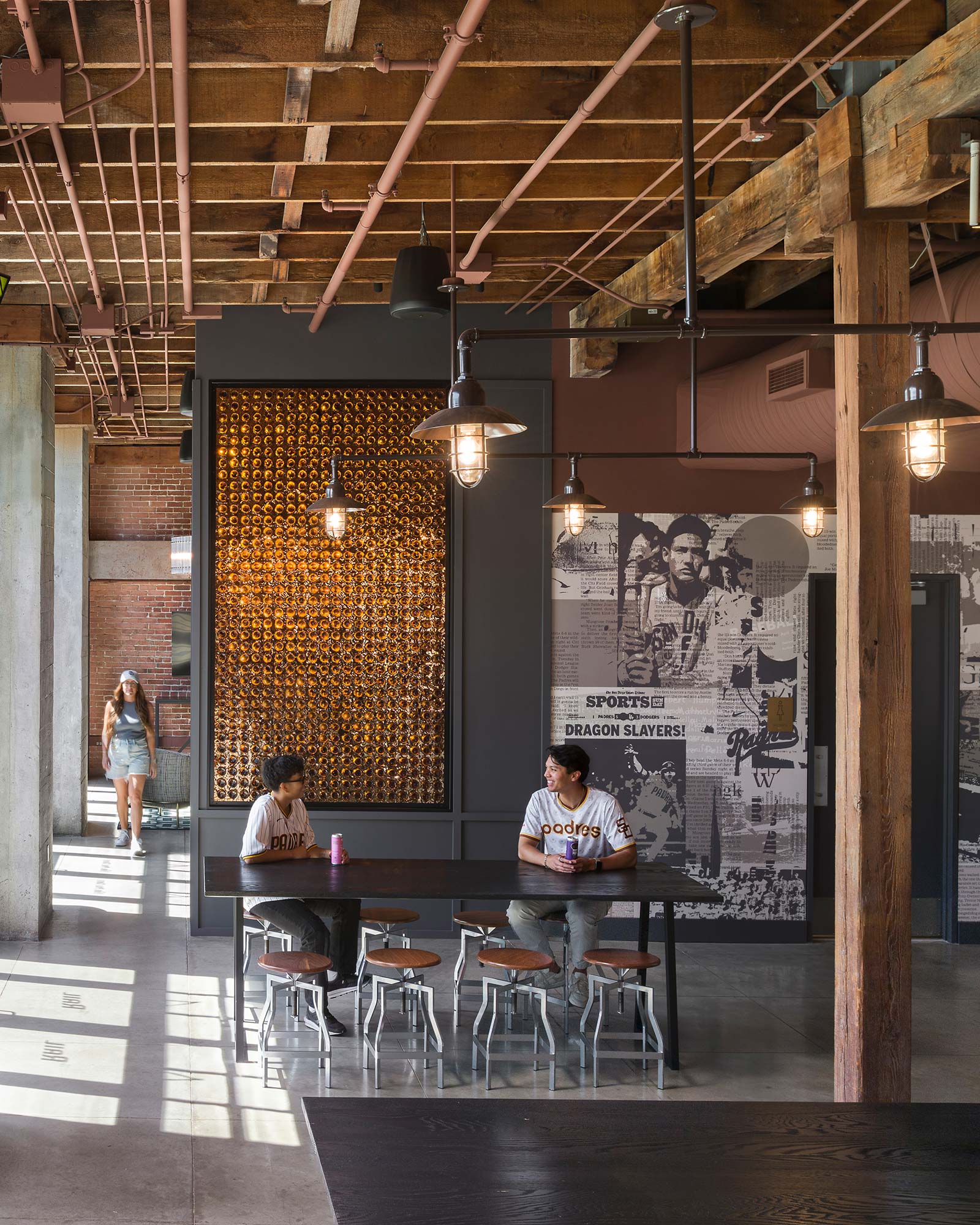 A man and woman sitting at a table in a restaurant.