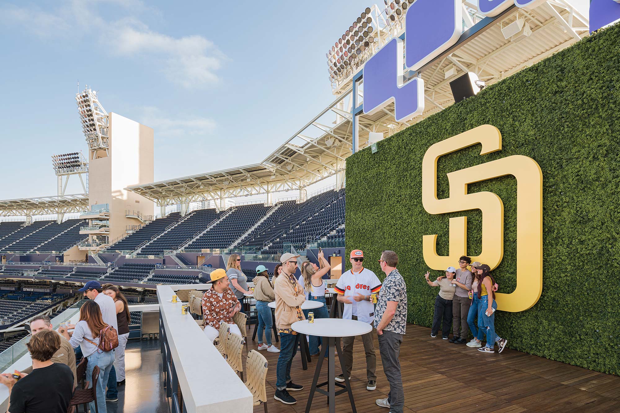 A group of people standing outside.