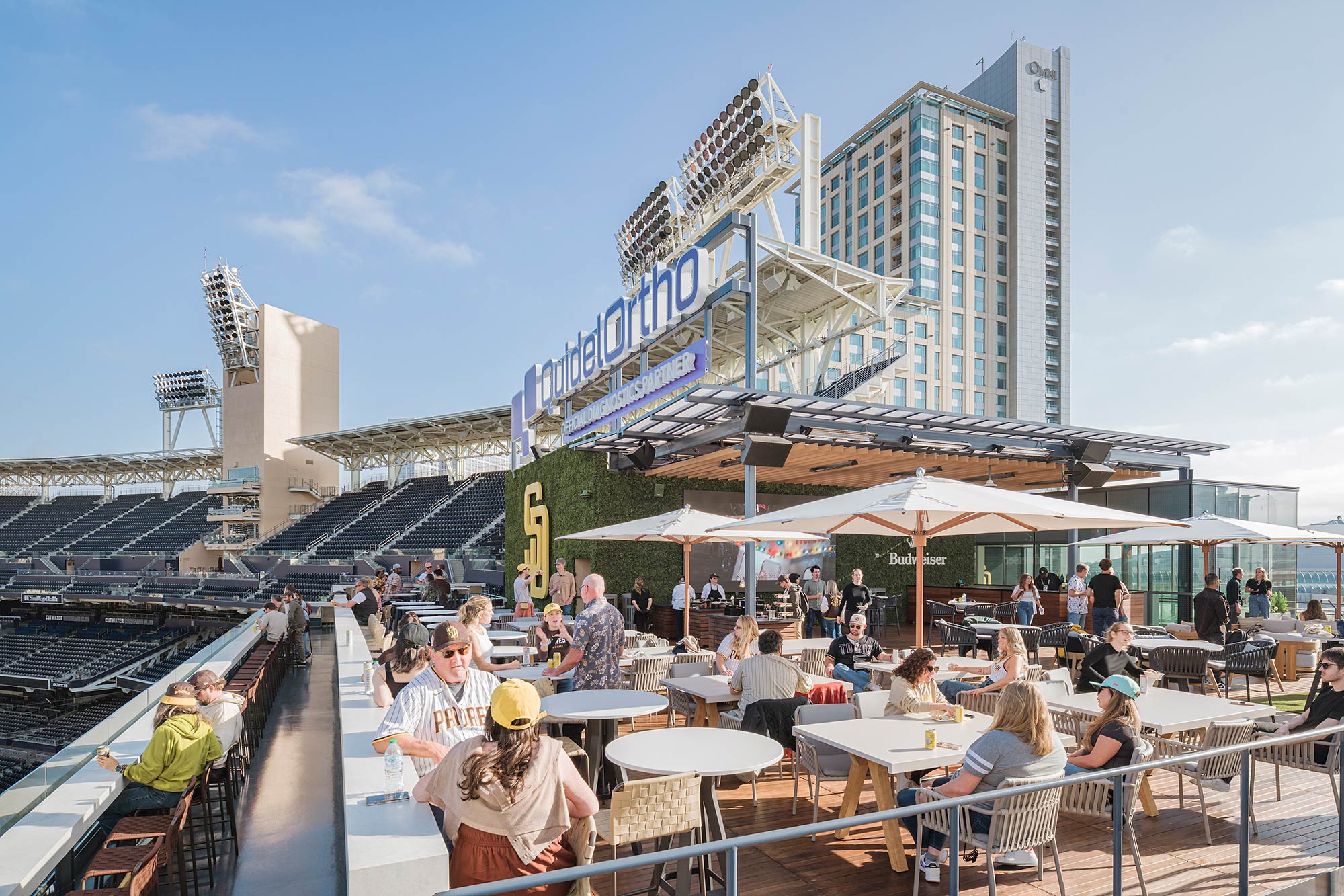 A group of people sitting at tables.