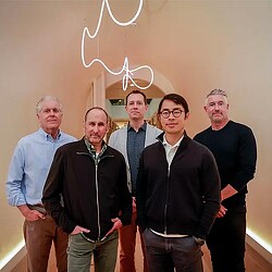 A group of men posing for a photo.