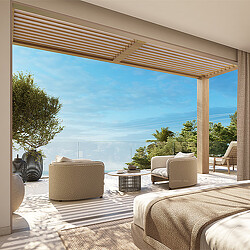 A room with a large window and a patio with a table and chairs.