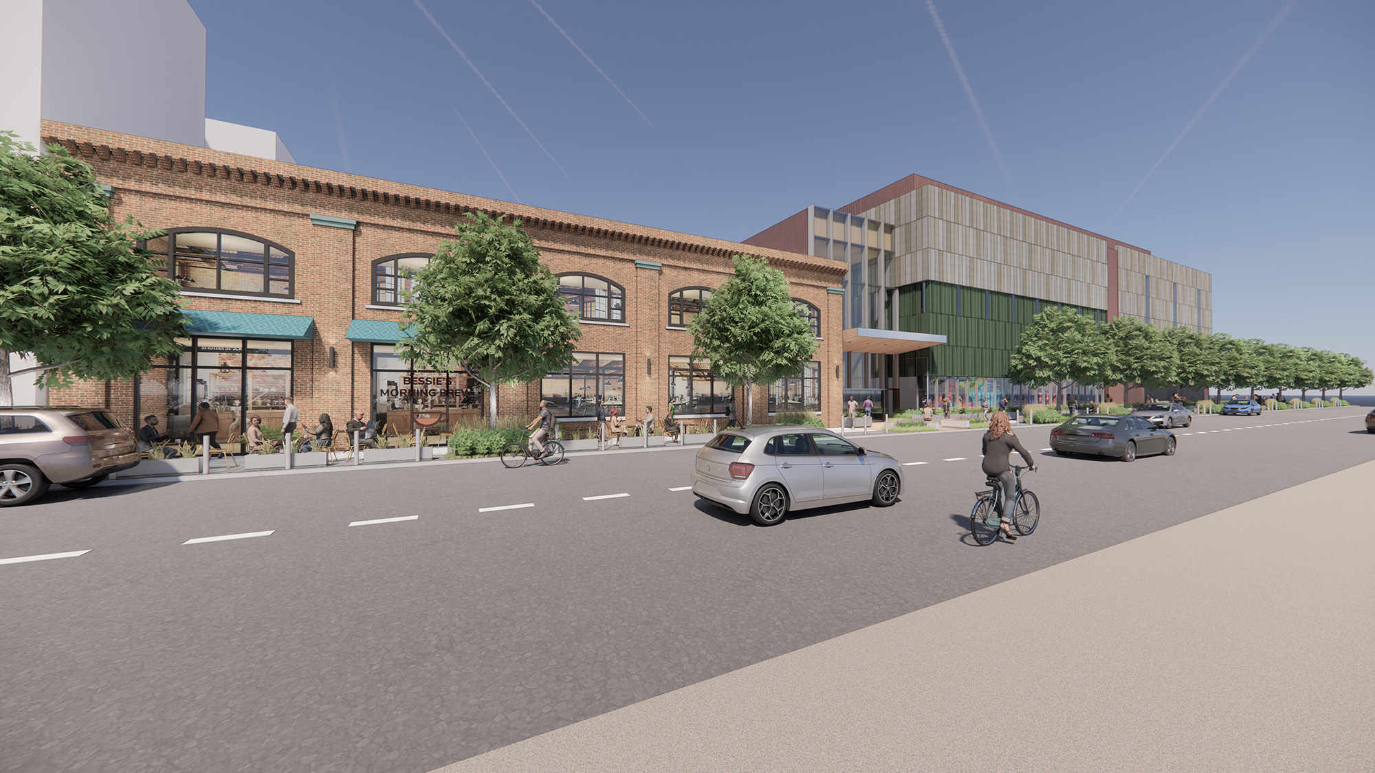 A person riding a bicycle on a street next to a building.