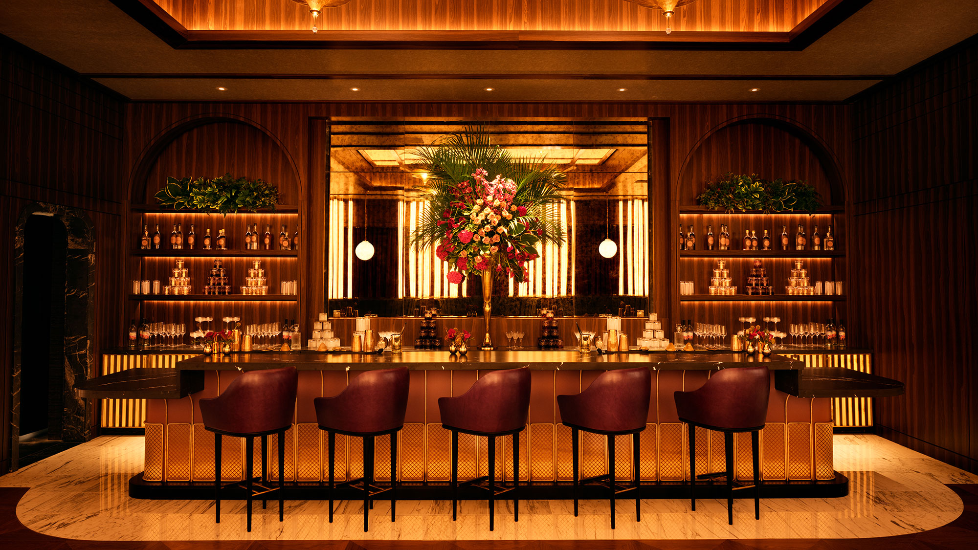 A bar with chairs and a table.