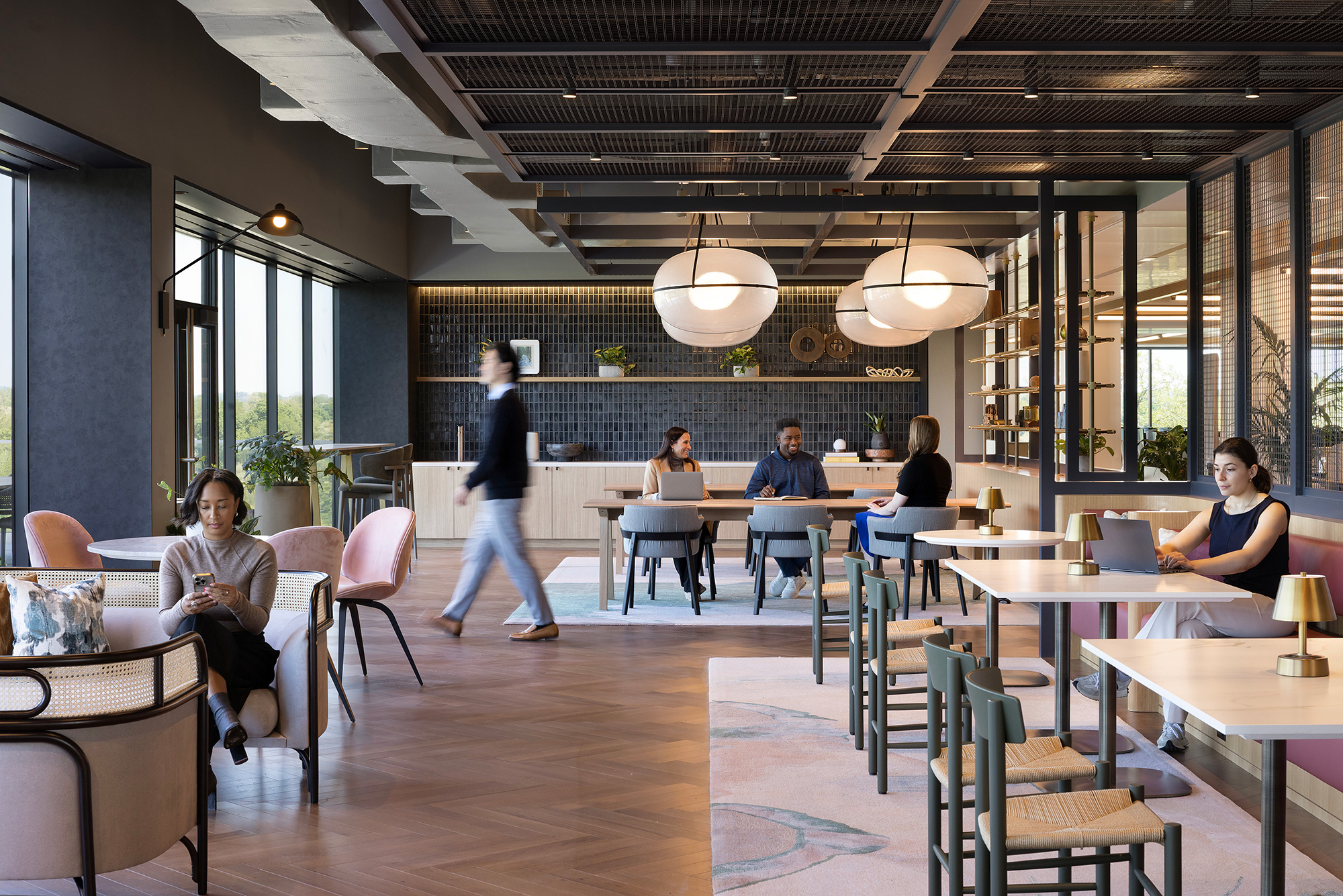 A group of people sitting at tables.