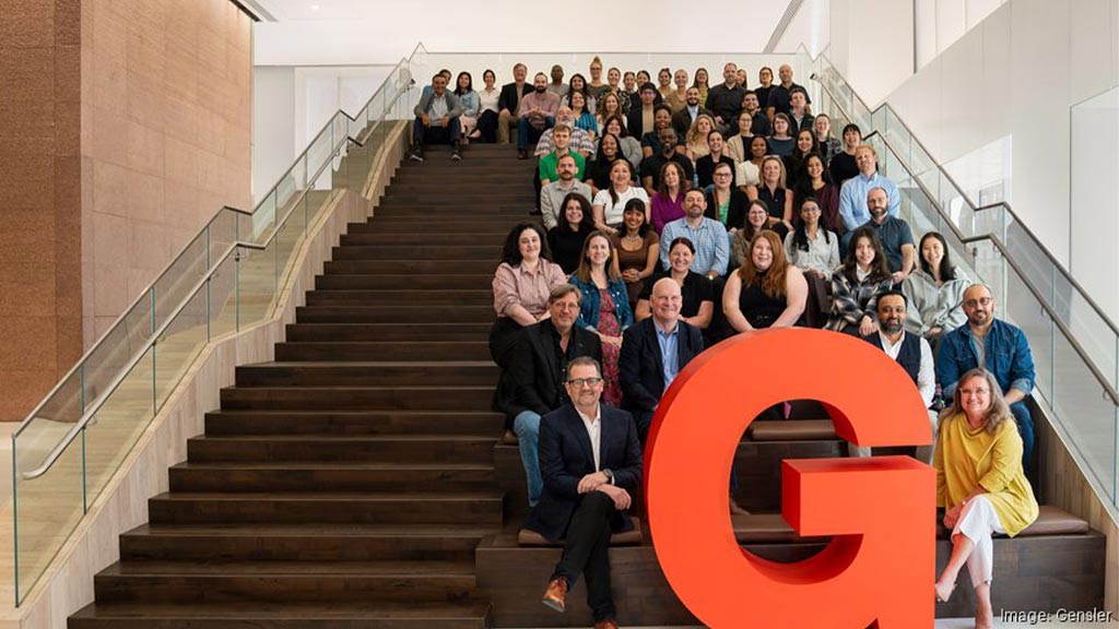 A group of people sitting on stairs.