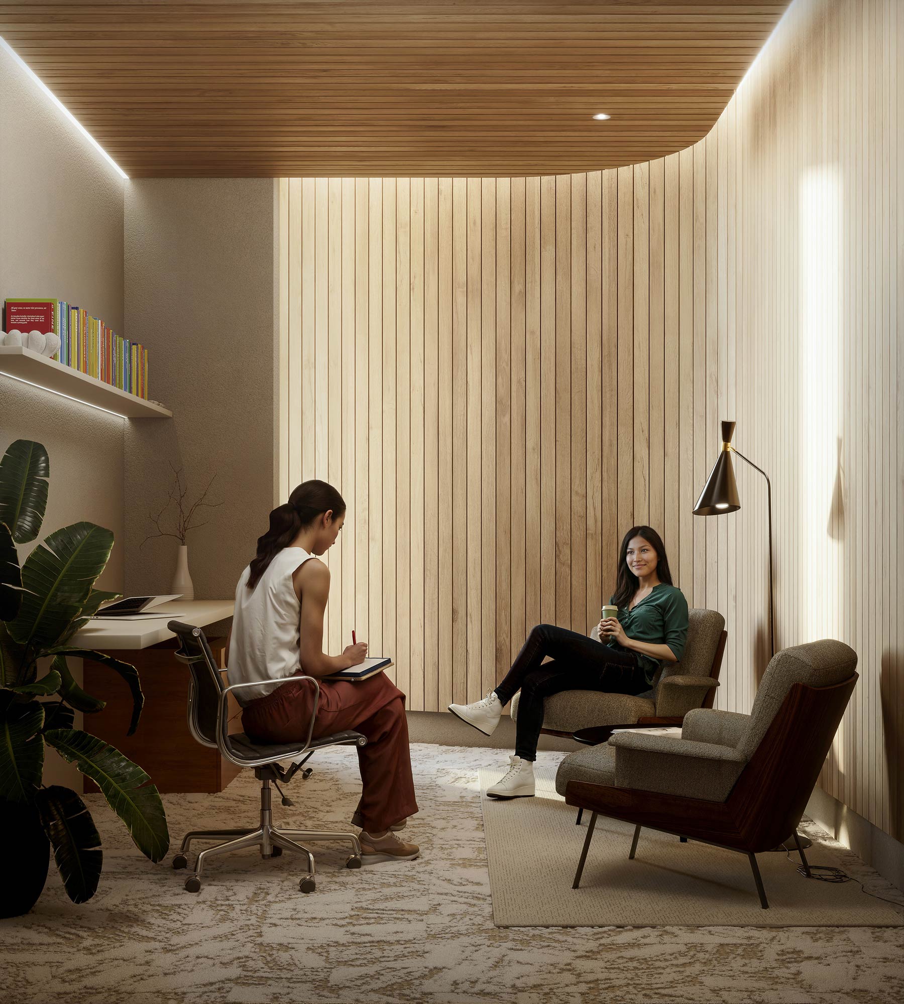 A couple of women sitting in chairs.