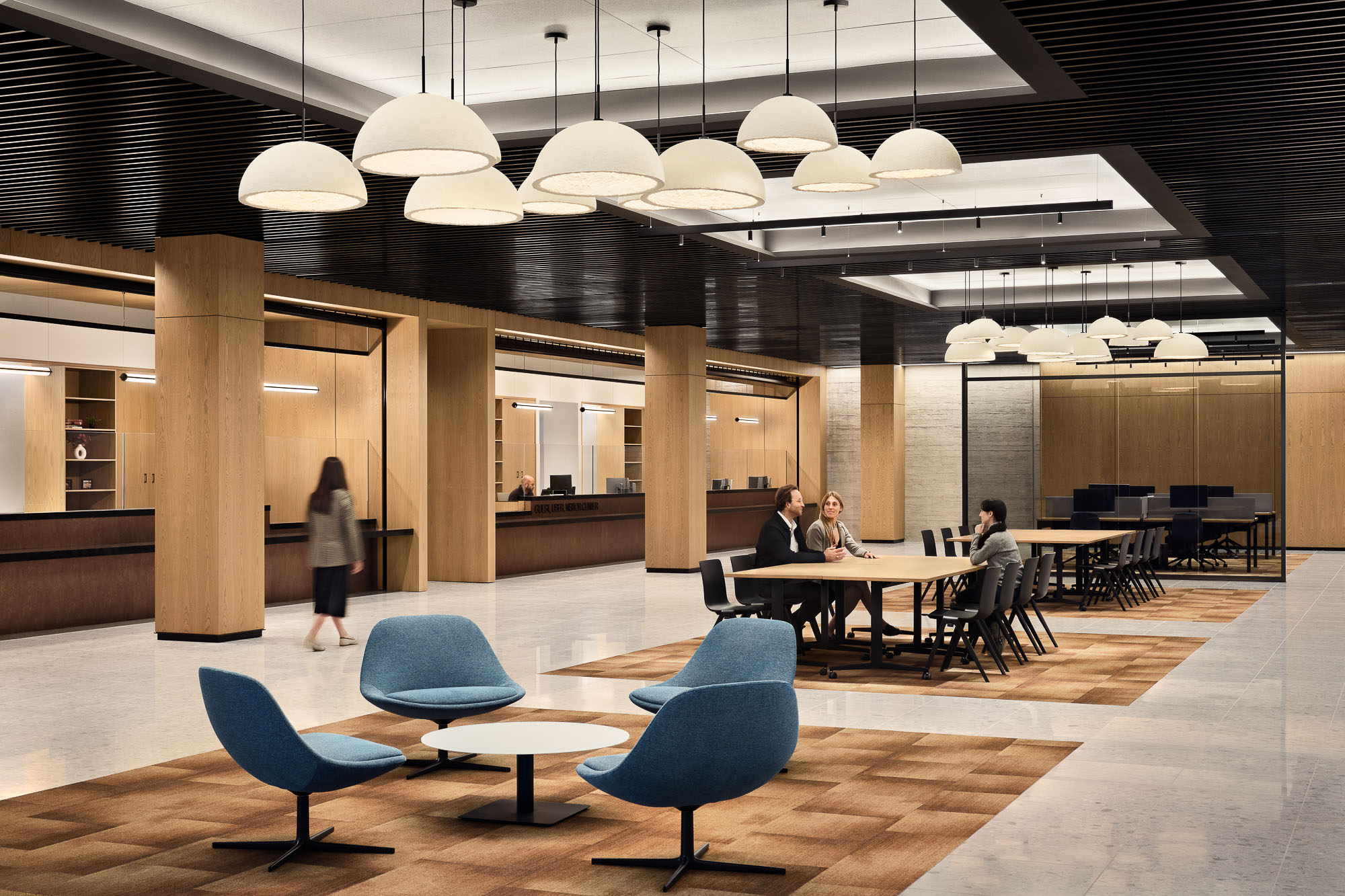 A group of people sitting at tables.