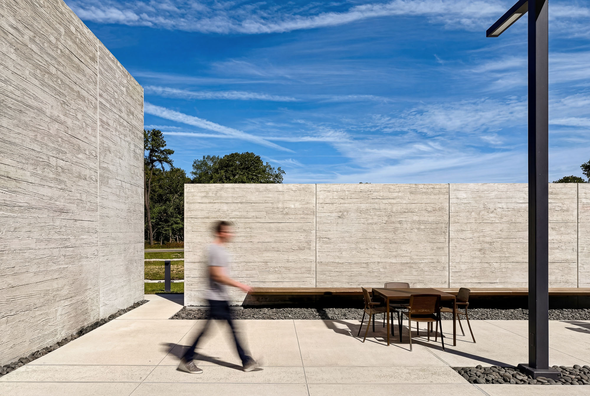 A person walking on a sidewalk.