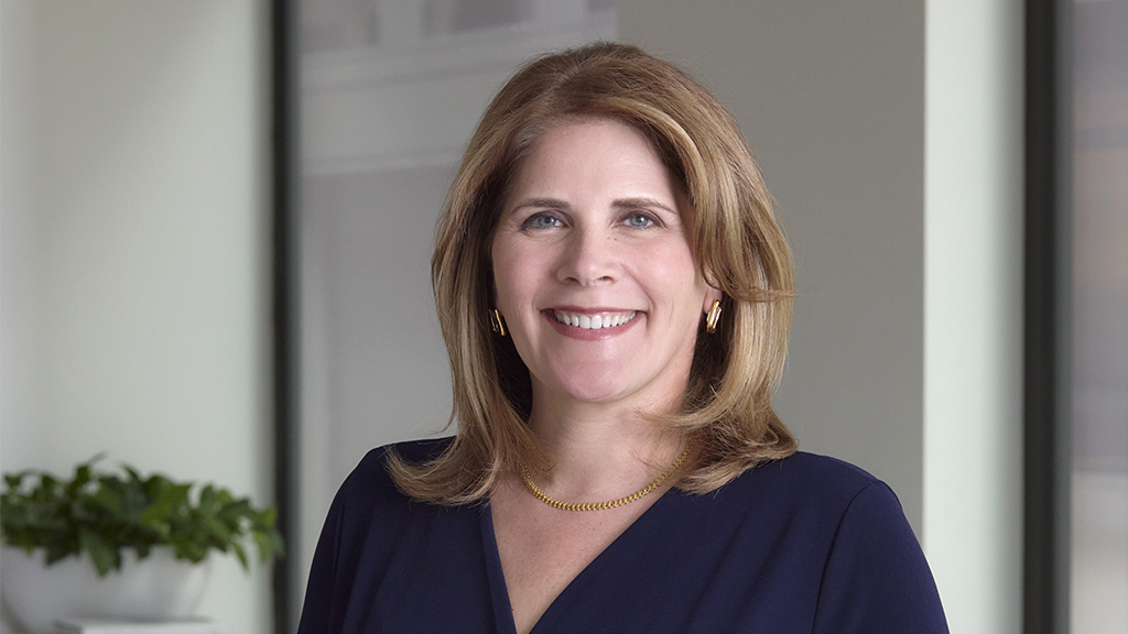 A woman smiling for the camera.