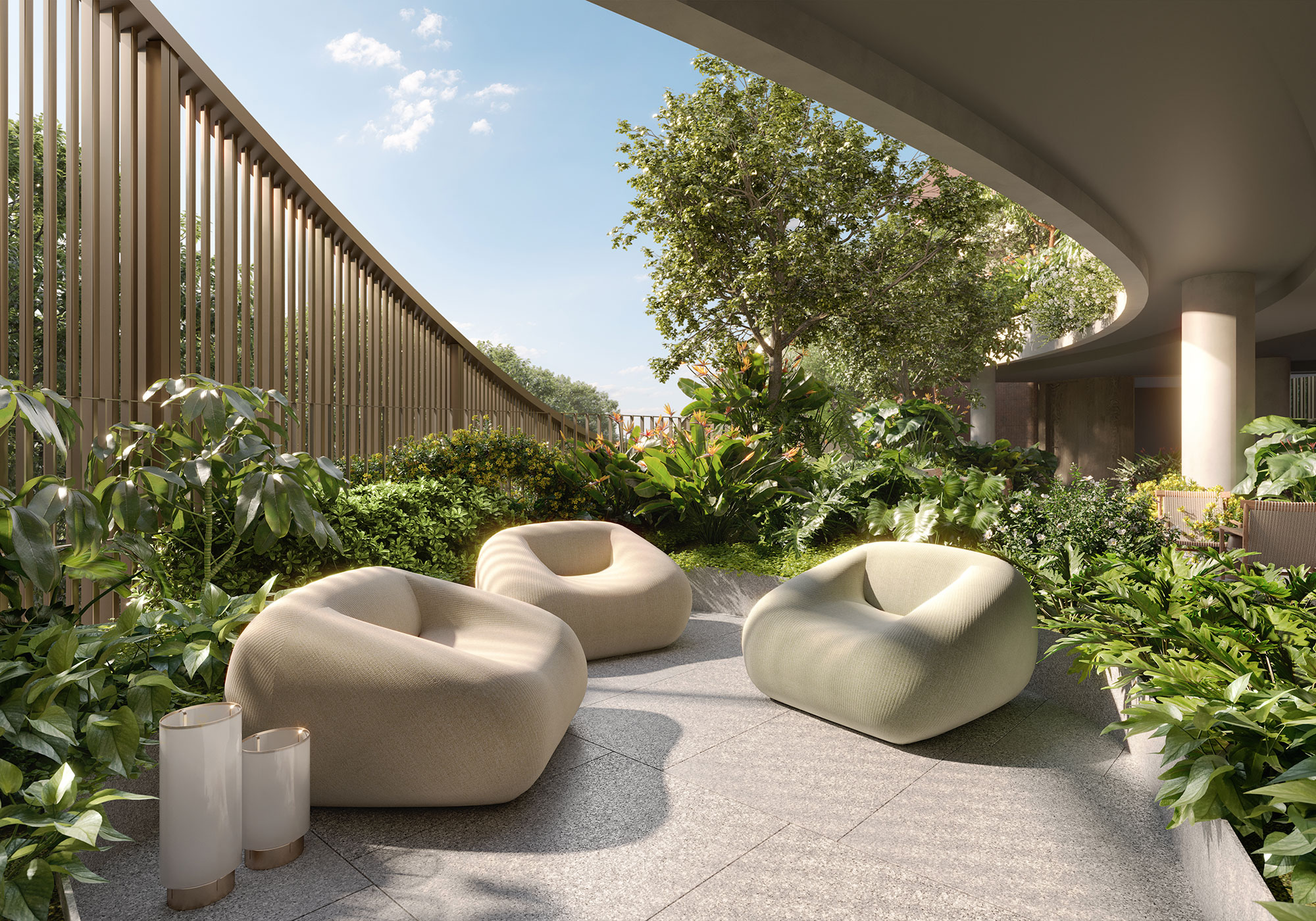 A group of white cushions on a patio with trees and a fence.