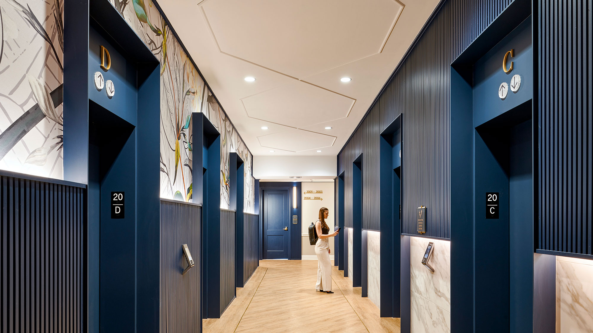 A person standing in a hallway.