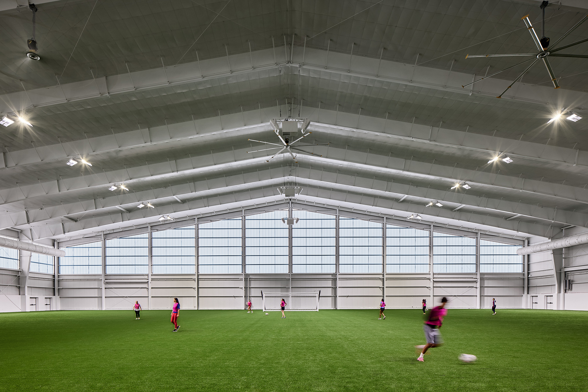 A group of people playing football.
