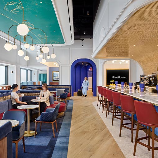 A restaurant with tables and chairs.