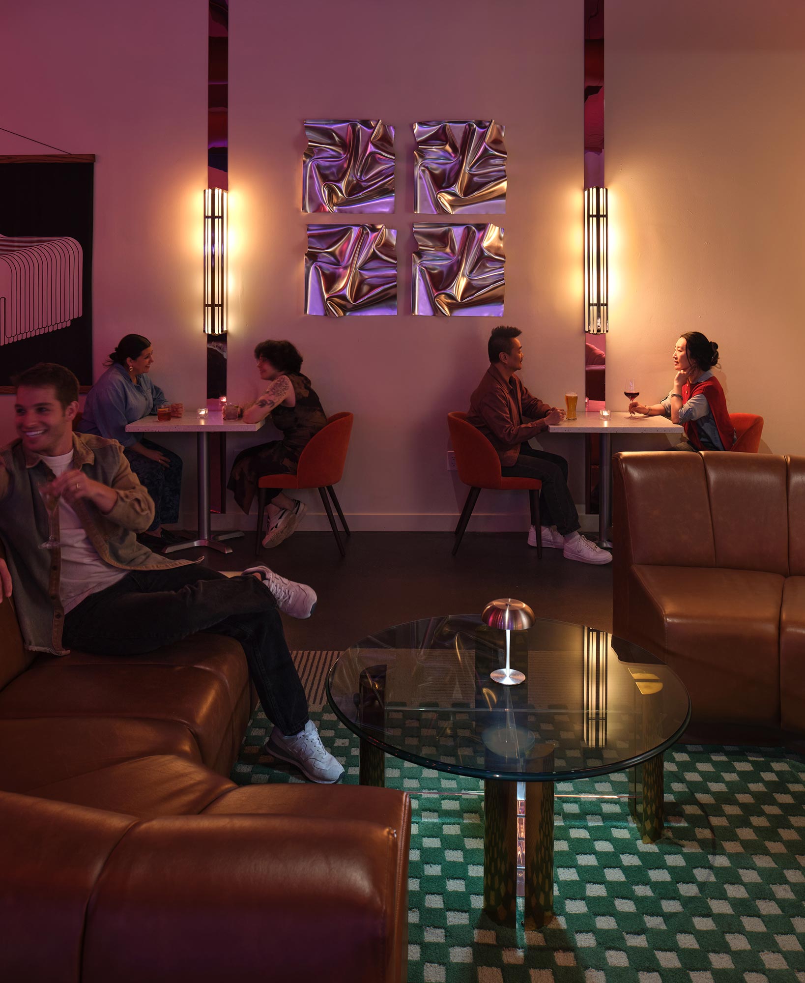 A group of people sitting around a table.