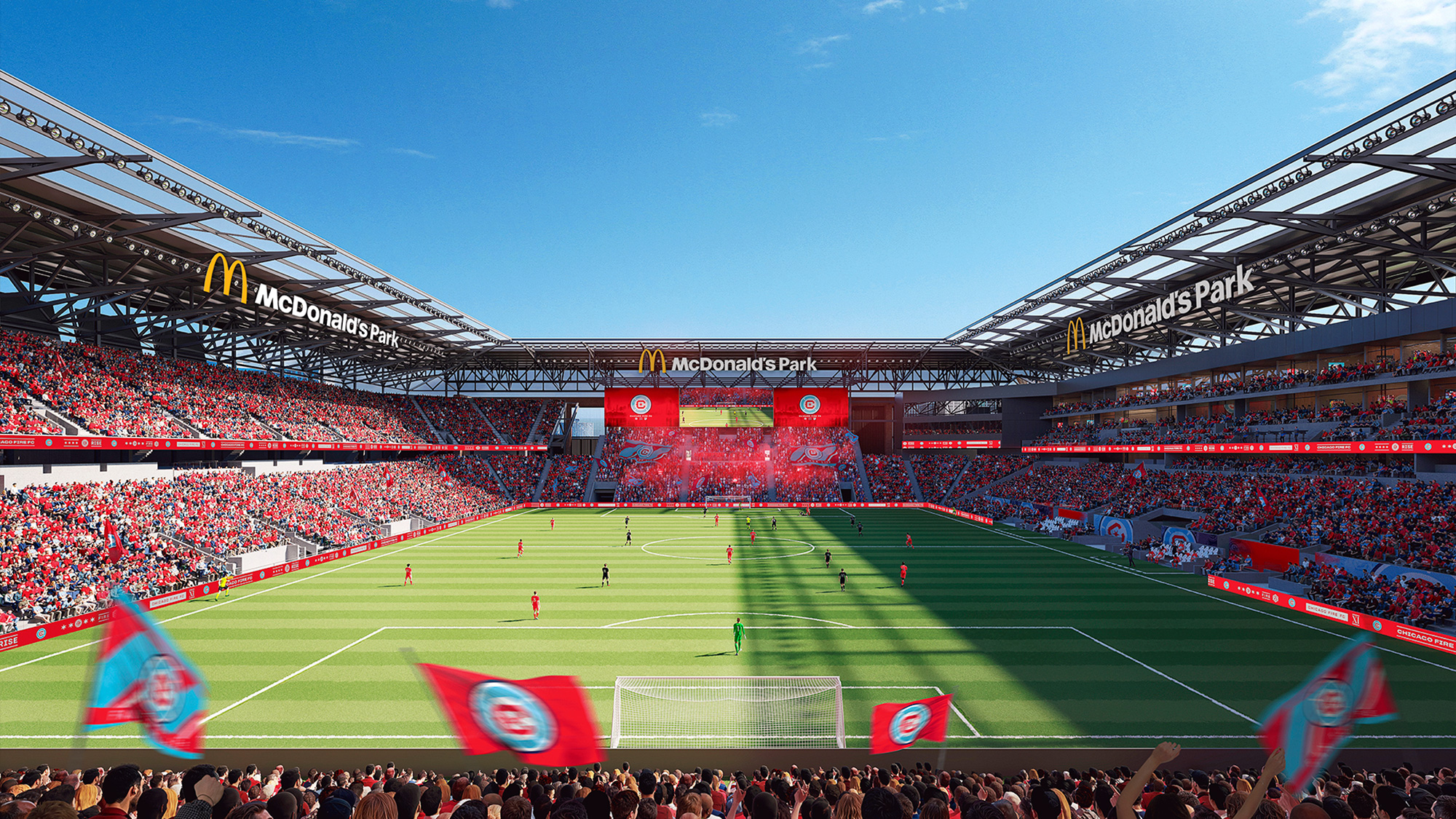 A football stadium with a field and players on the field.
