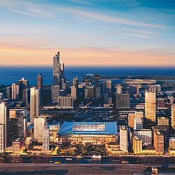 A city with a large body of water in the background.