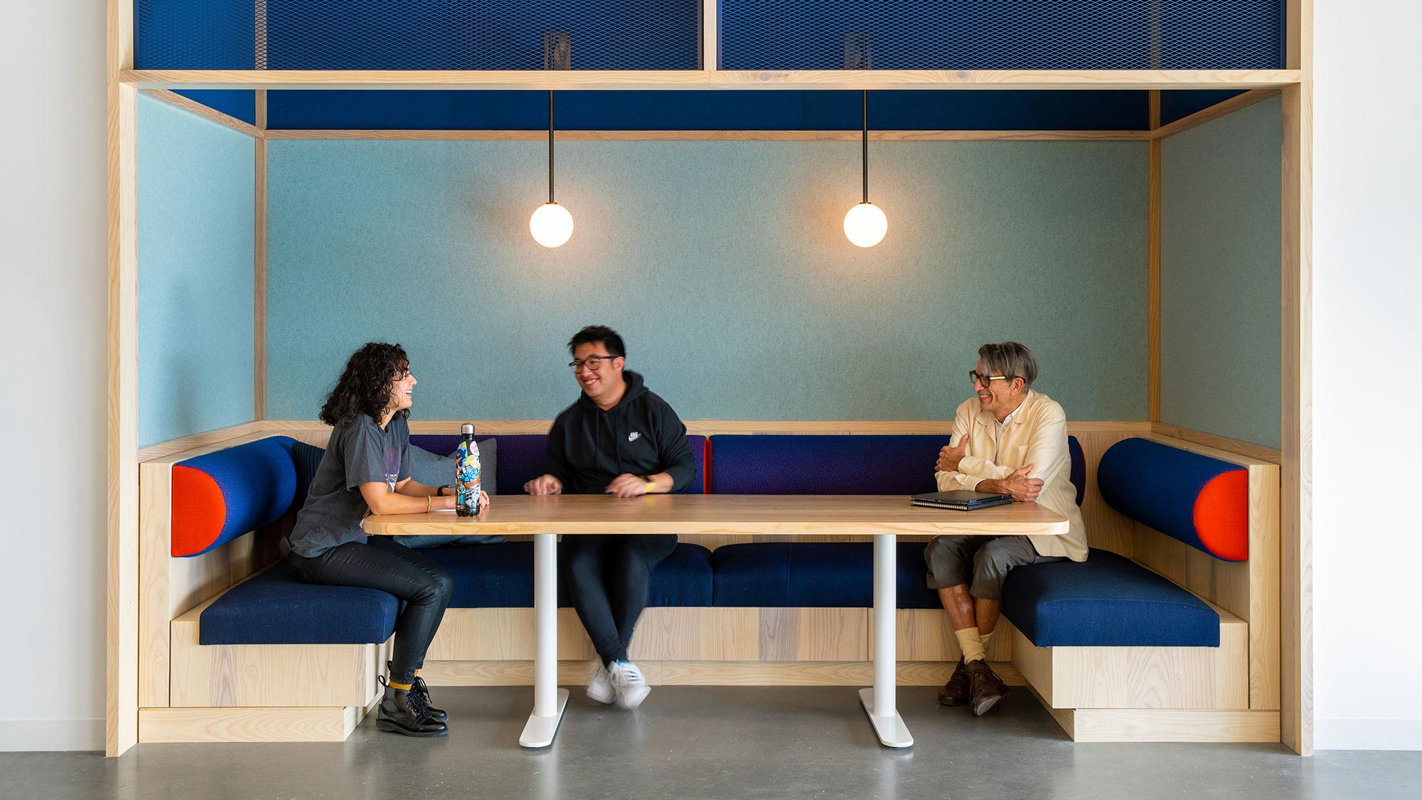 A group of people sitting at a table.
