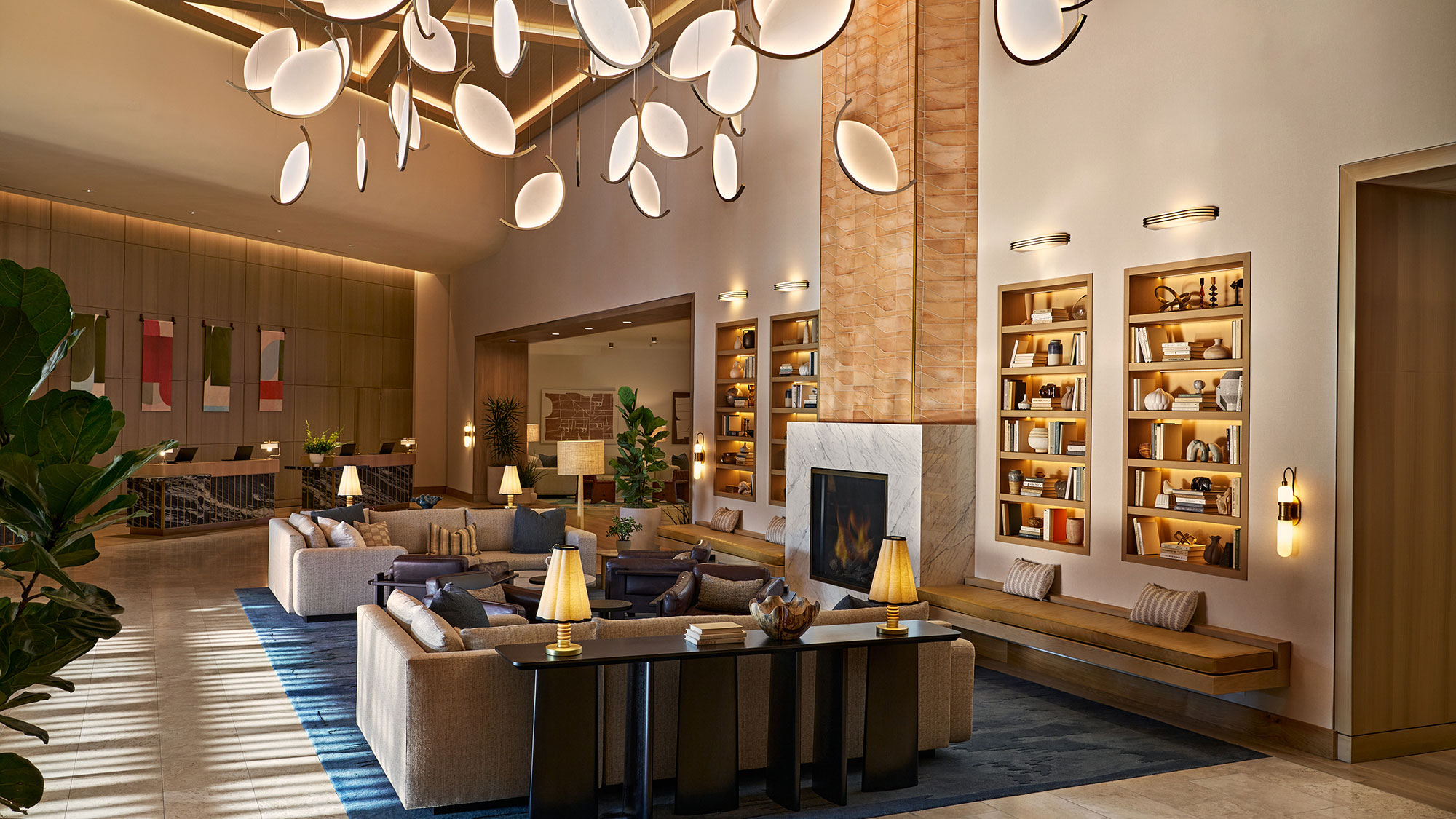 A living room with a fireplace and a table.