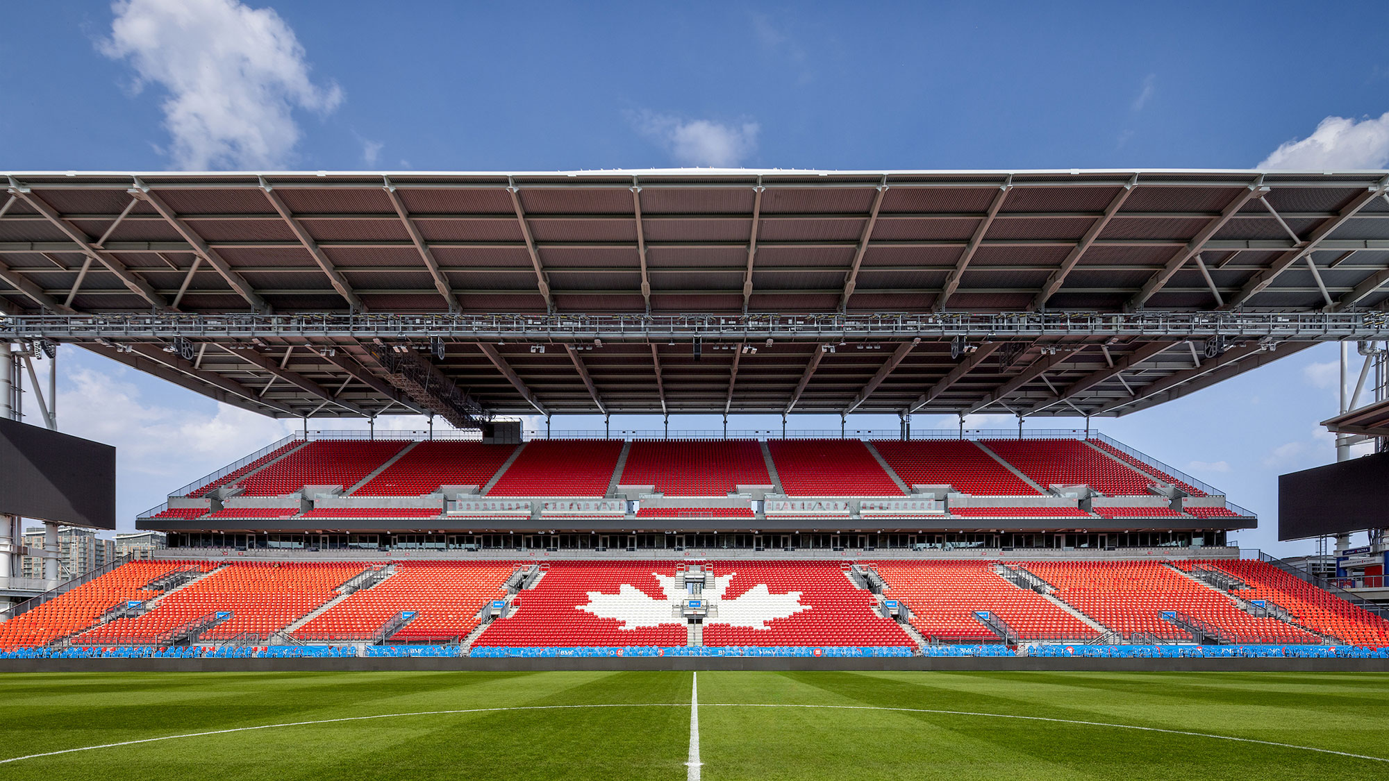 A sports stadium with a field.
