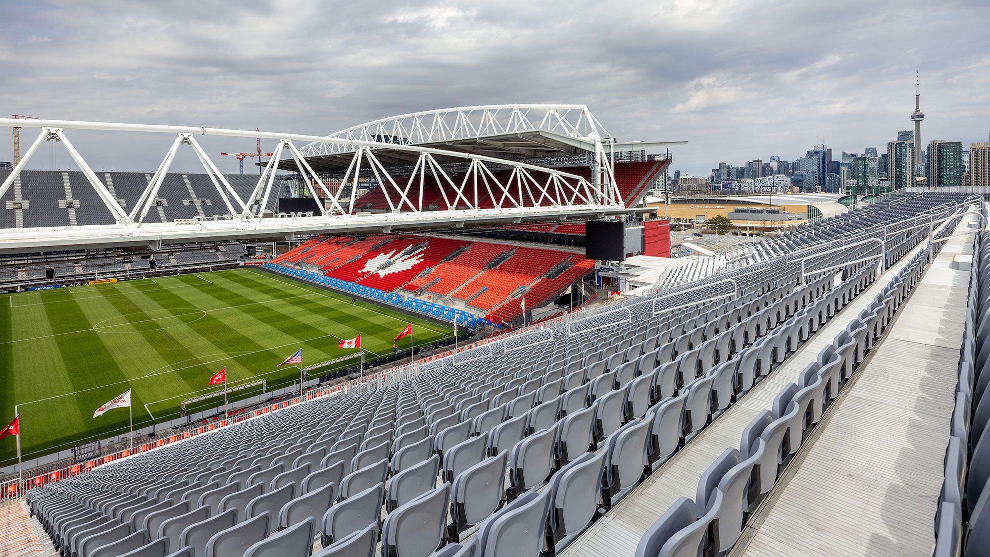 A sports stadium with a field and a large field.