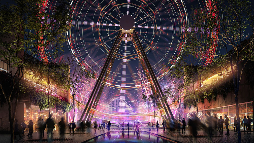 A group of people walking around a large circular structure with lights.