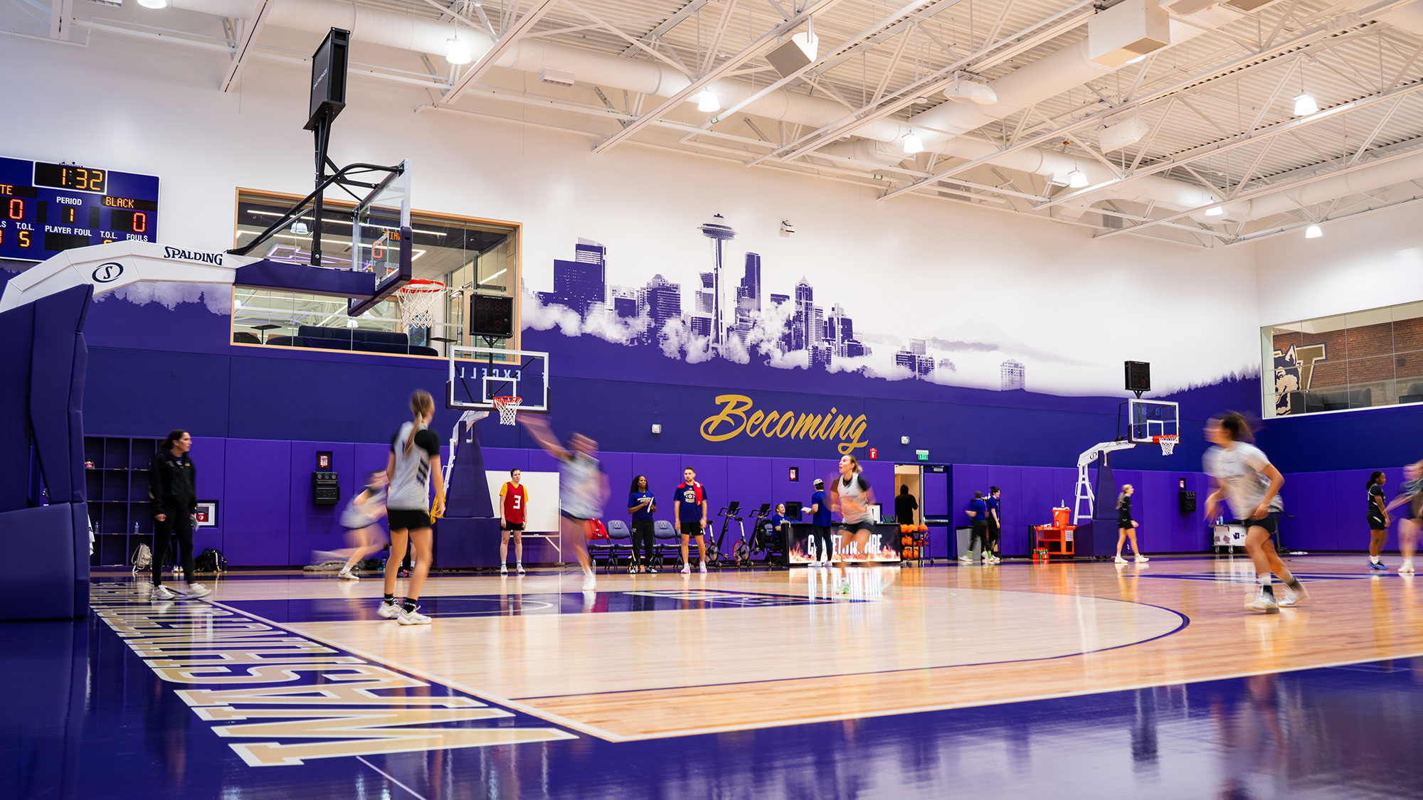 A group of people playing basketball.