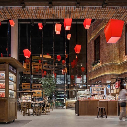 A building with lanterns from the ceiling.