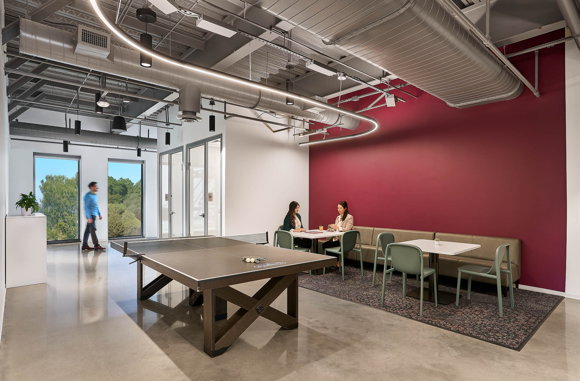 A room with tables and chairs.
