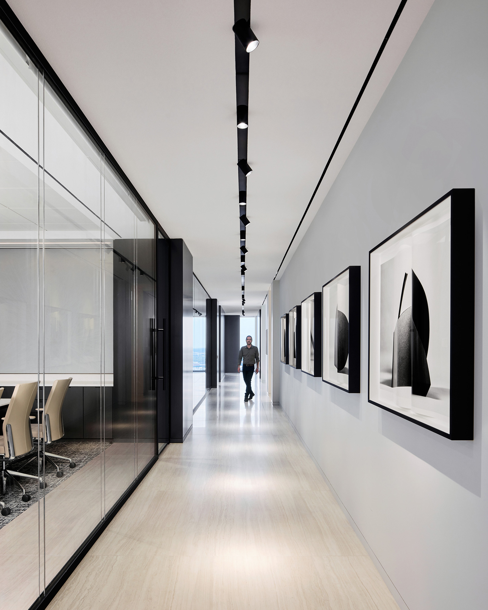 A person walking down a hall.