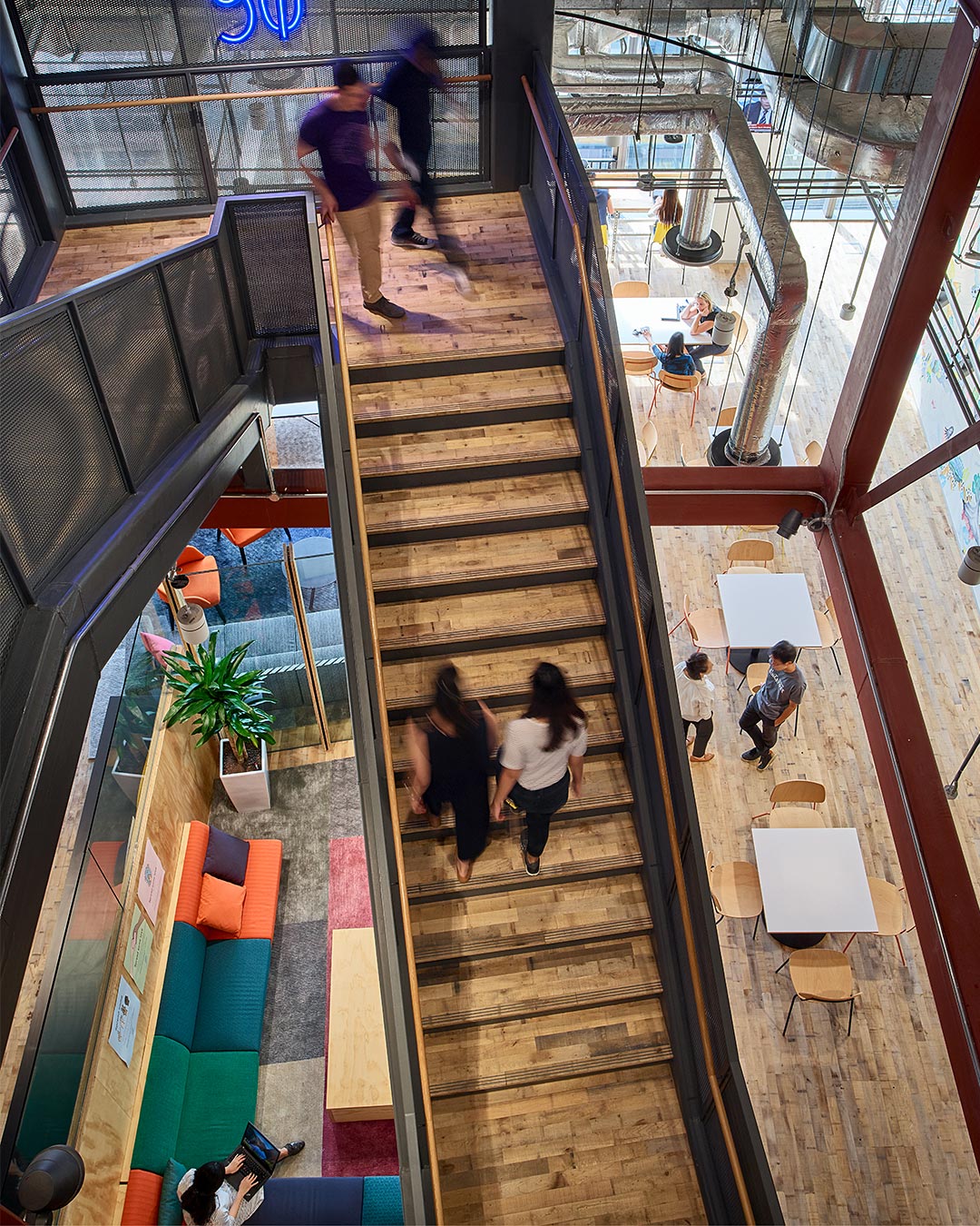 People walking up a flight of stairs.