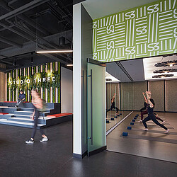 A few women running in a gym.