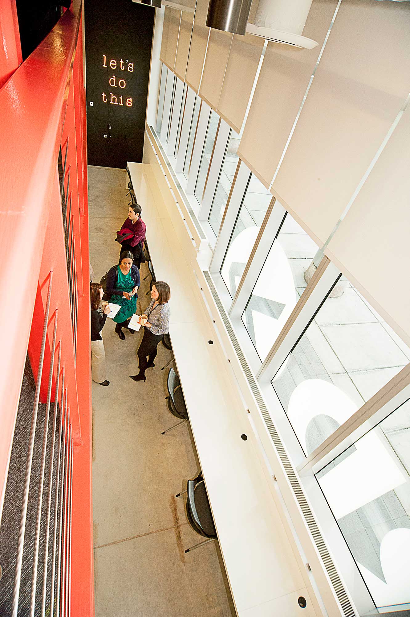 People walking down a hallway.